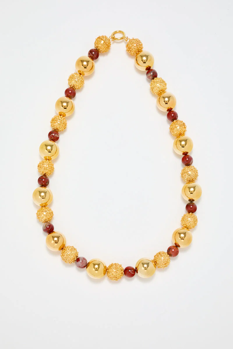 Gold Sculptural Necklace With Red Pearl Detail