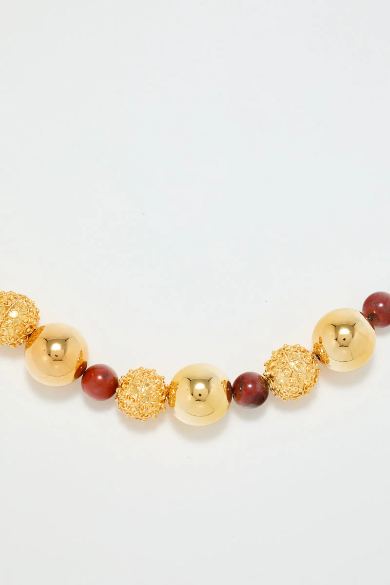 Gold Sculptural Necklace With Red Pearl Detail - Image 3