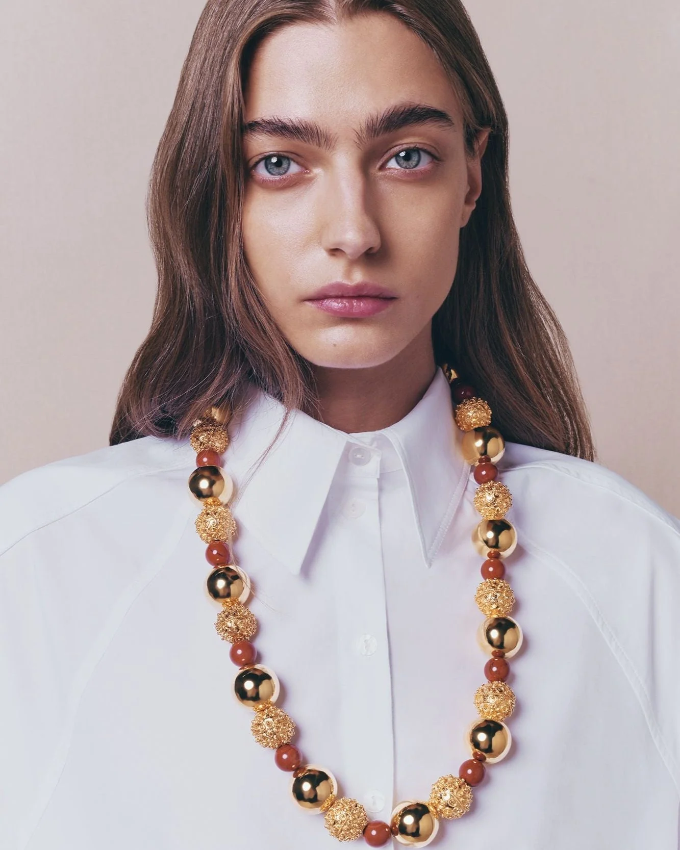 Gold Sculptural Necklace With Red Pearl Detail - Image 6