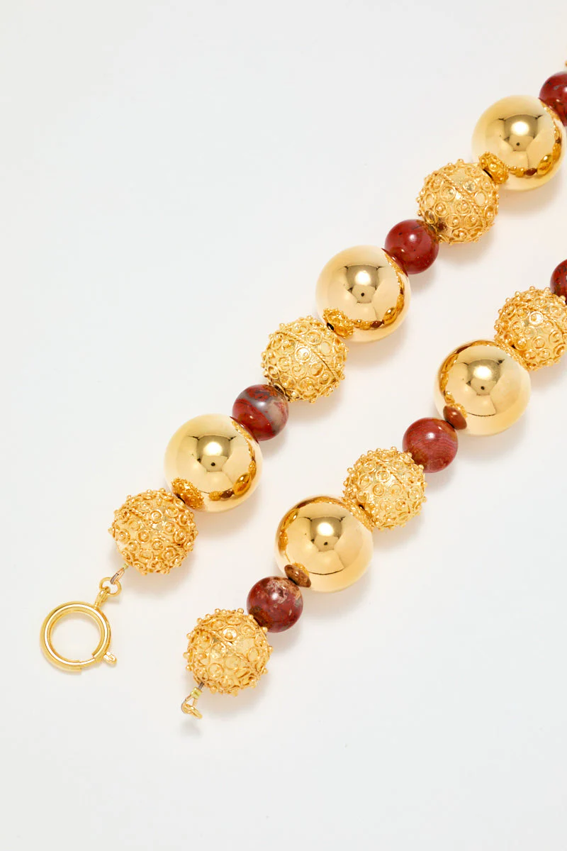 Gold Sculptural Necklace With Red Pearl Detail - Image 8