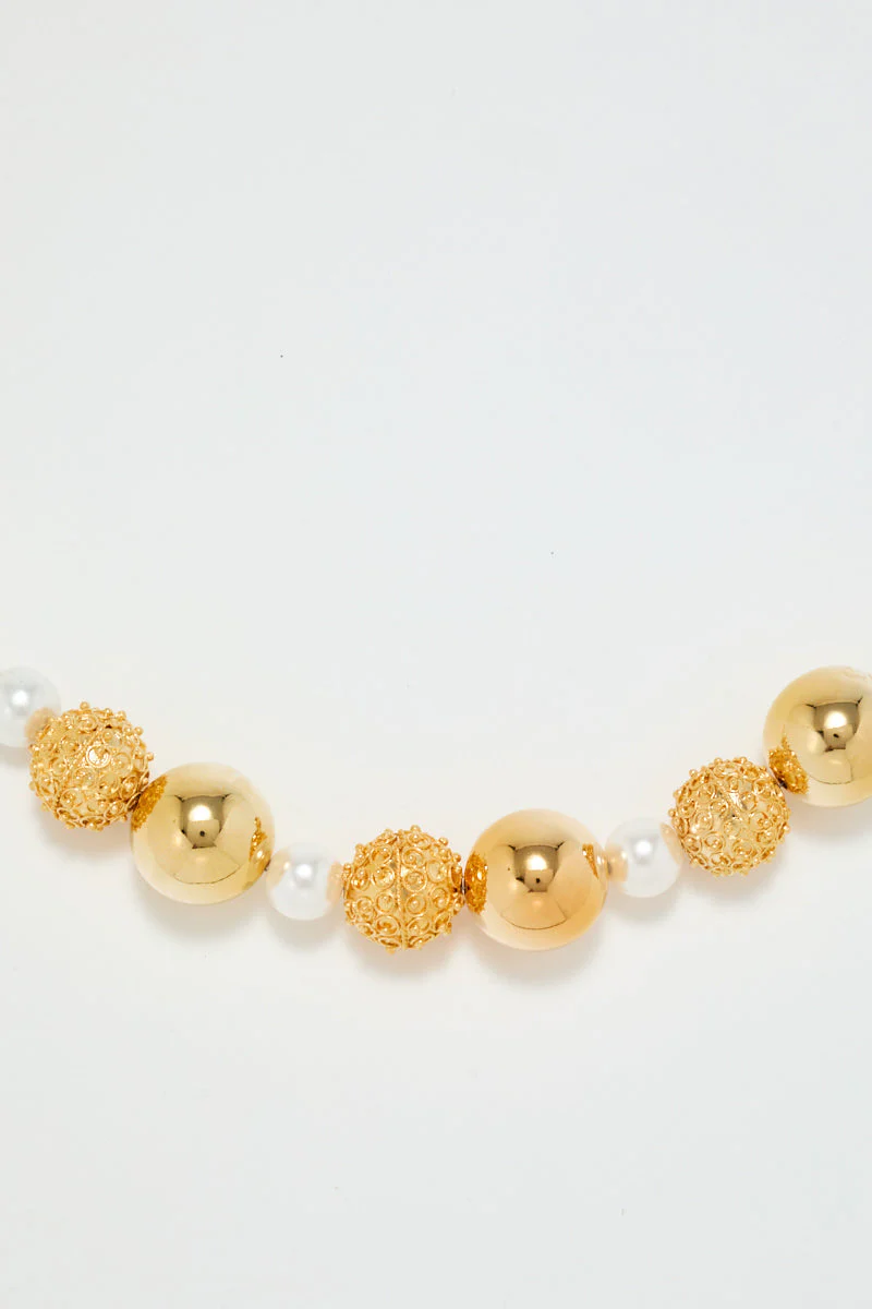 Gold Sculptural Necklace With White Pearl Detail - Image 2