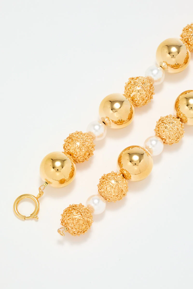 Gold Sculptural Necklace With White Pearl Detail - Image 3