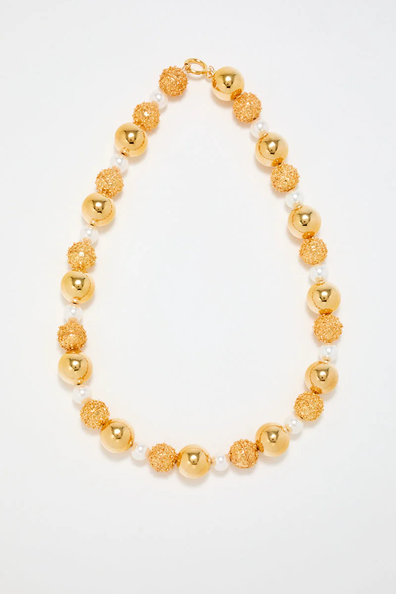 Gold Sculptural Necklace With White Pearl Detail - Image 4